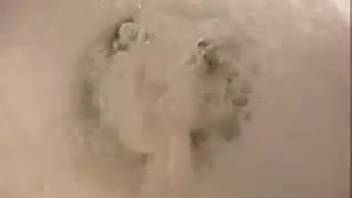Girl defecating on the toilet while spreading her vagina