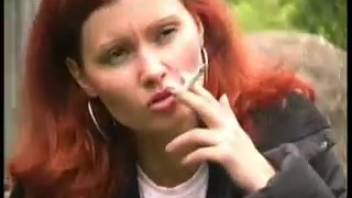 Ginger babe peeing on a newspaper